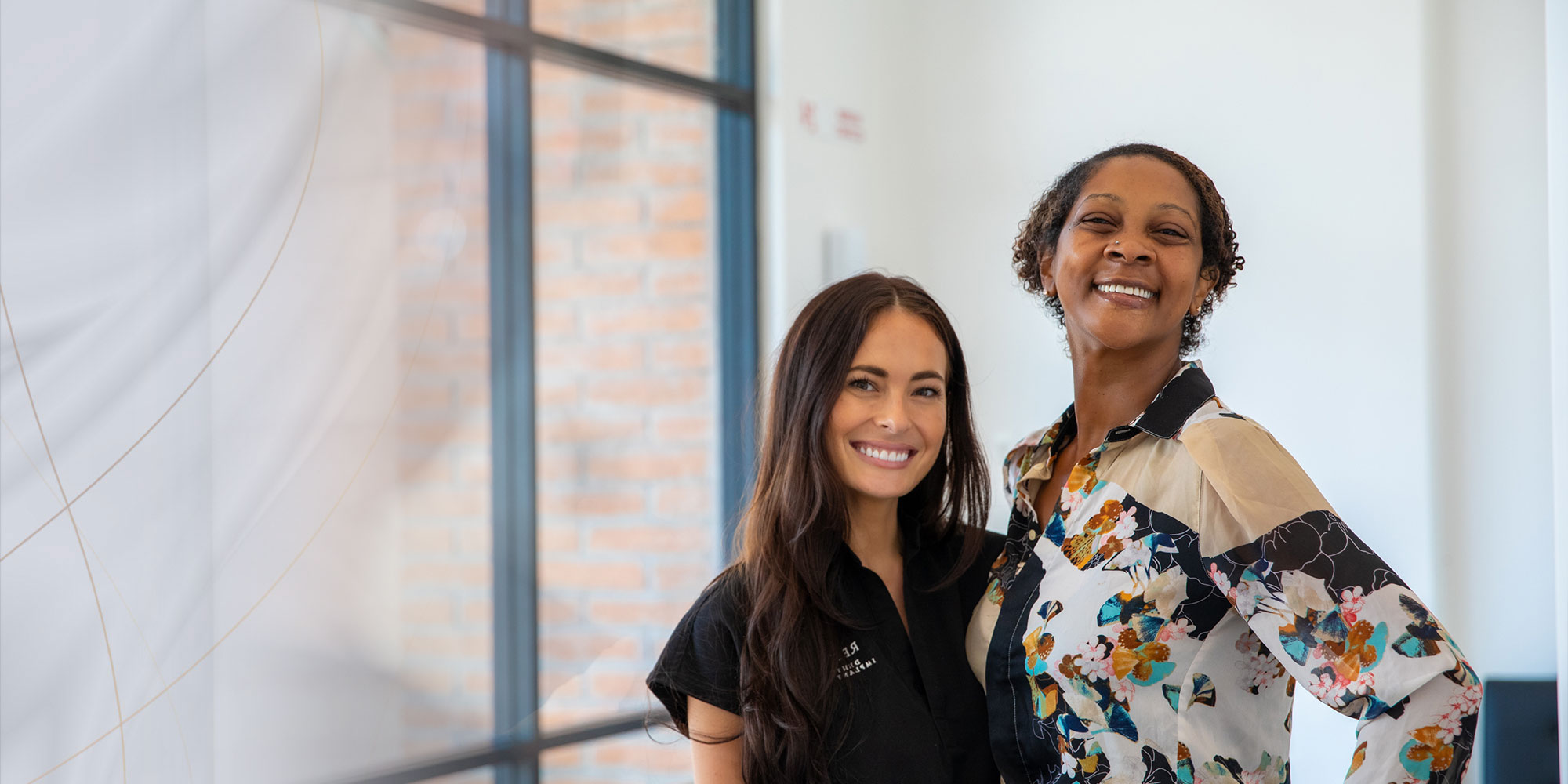 patient and doctor smiling after patient's dental procedure