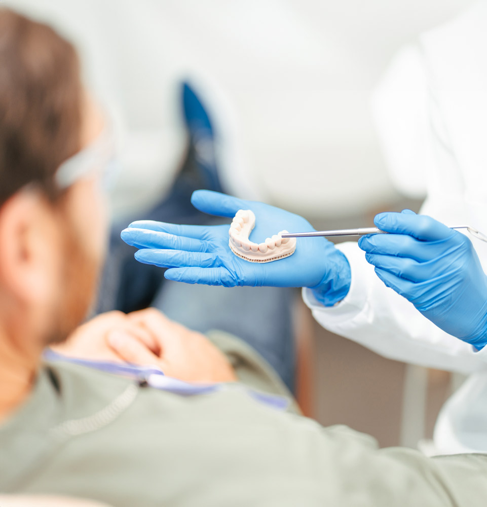 Doctor showing patient example model